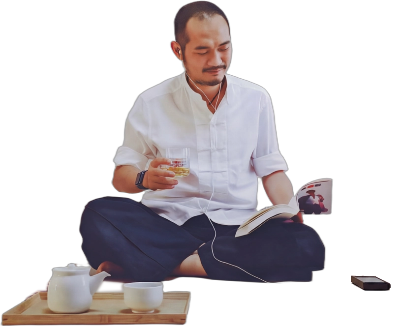 Twinsen reading with tea tray and player